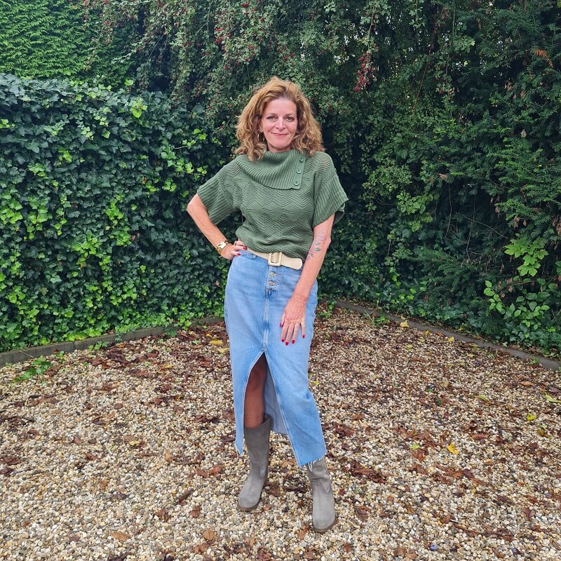 Sage green boots with a denim skirt