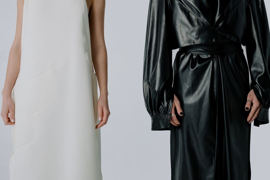 Stylish fashion composition showcasing black and white outfits with minimalistic elegance.