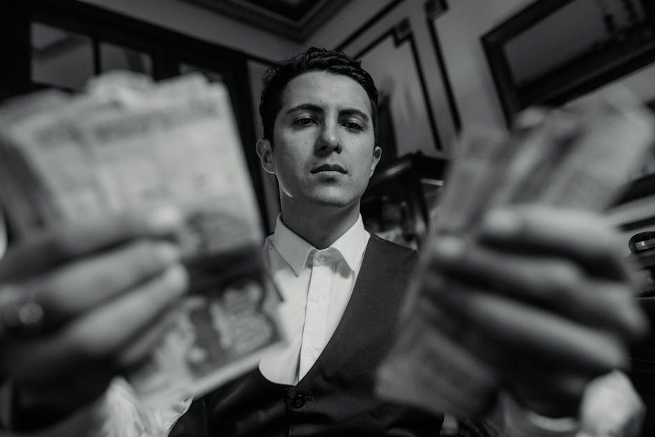 Black and white image of a man in a vest holding cash, exuding wealth and sophistication in Buenos Aires.
