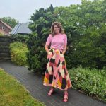 Styling a Pink Print Midi Skirt with Classic pink Accents